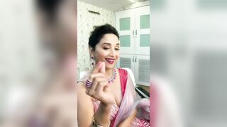 53 years old Madhuri Dixit showing her delicious milf cleavage