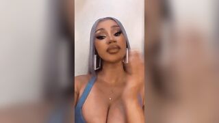 Cardi getting ready to take a big load all over her face and cleavage