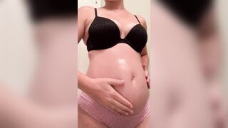 Clothed Pregnant Women: Have to keep the bump nice and moisturized ♥️♥️ #2